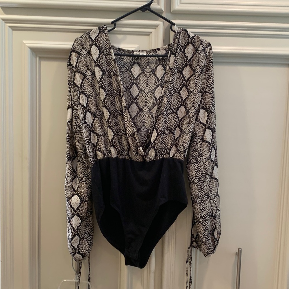 peach love bodysuit size large animal print long sleeves that are open with ties